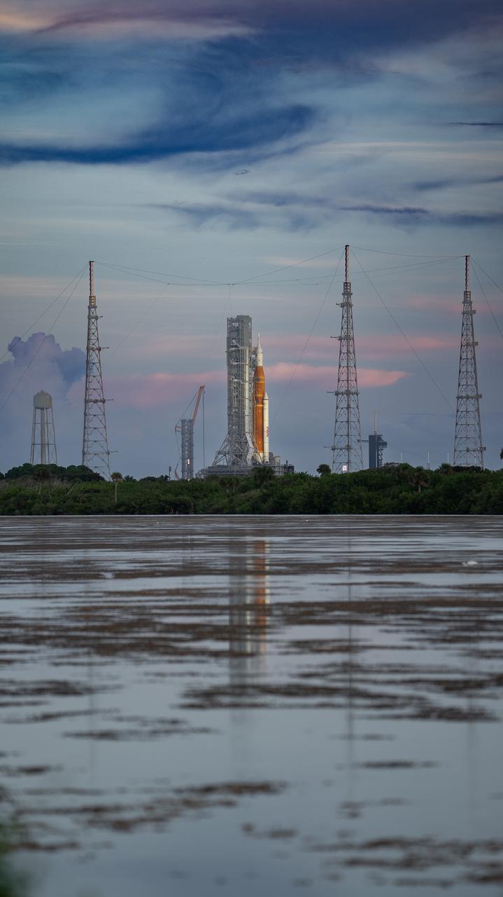 NASA’s Space Launch System (SLS) rocket with the Orion spacecraft aboard is seen atop the mobile launcher at Launch Pad 39B at NASA’s Kennedy Space Center in Florida. Artemis I mission is the first integrated test of the agency’s deep space exploration systems: the Space Launch System rocket, Orion spacecraft, and supporting ground systems. The mission is the first in a series of increasingly complex missions to the Moon. Launch of the uncrewed flight test is targeted for no earlier than Sept. 3 at 2:17 p.m. ET. With Artemis missions, NASA will land the first woman and first person of color on the Moon, using innovative technologies to explore more of the lunar surface than ever before.